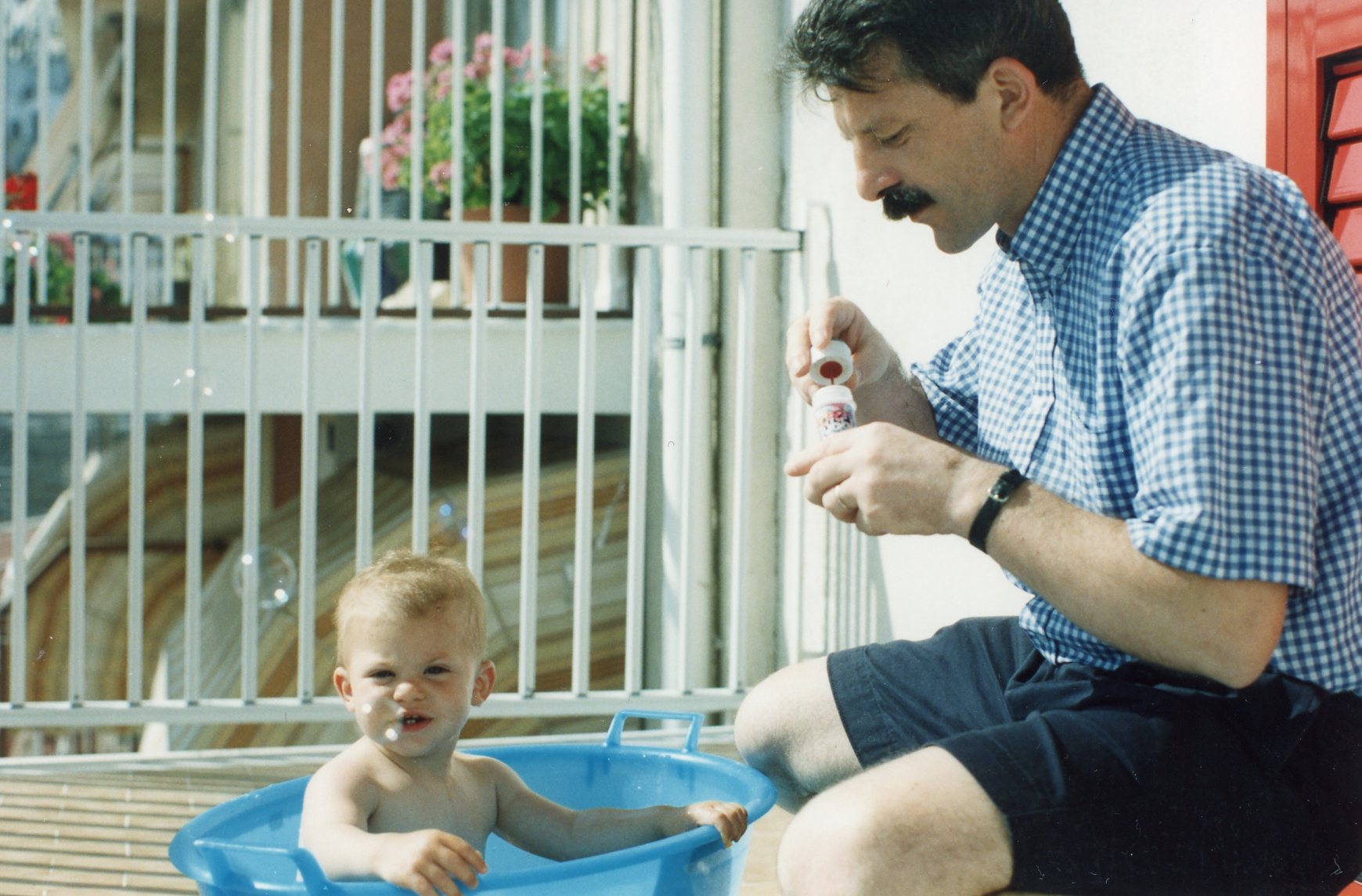 Francesco blowing bubbles with Sarah