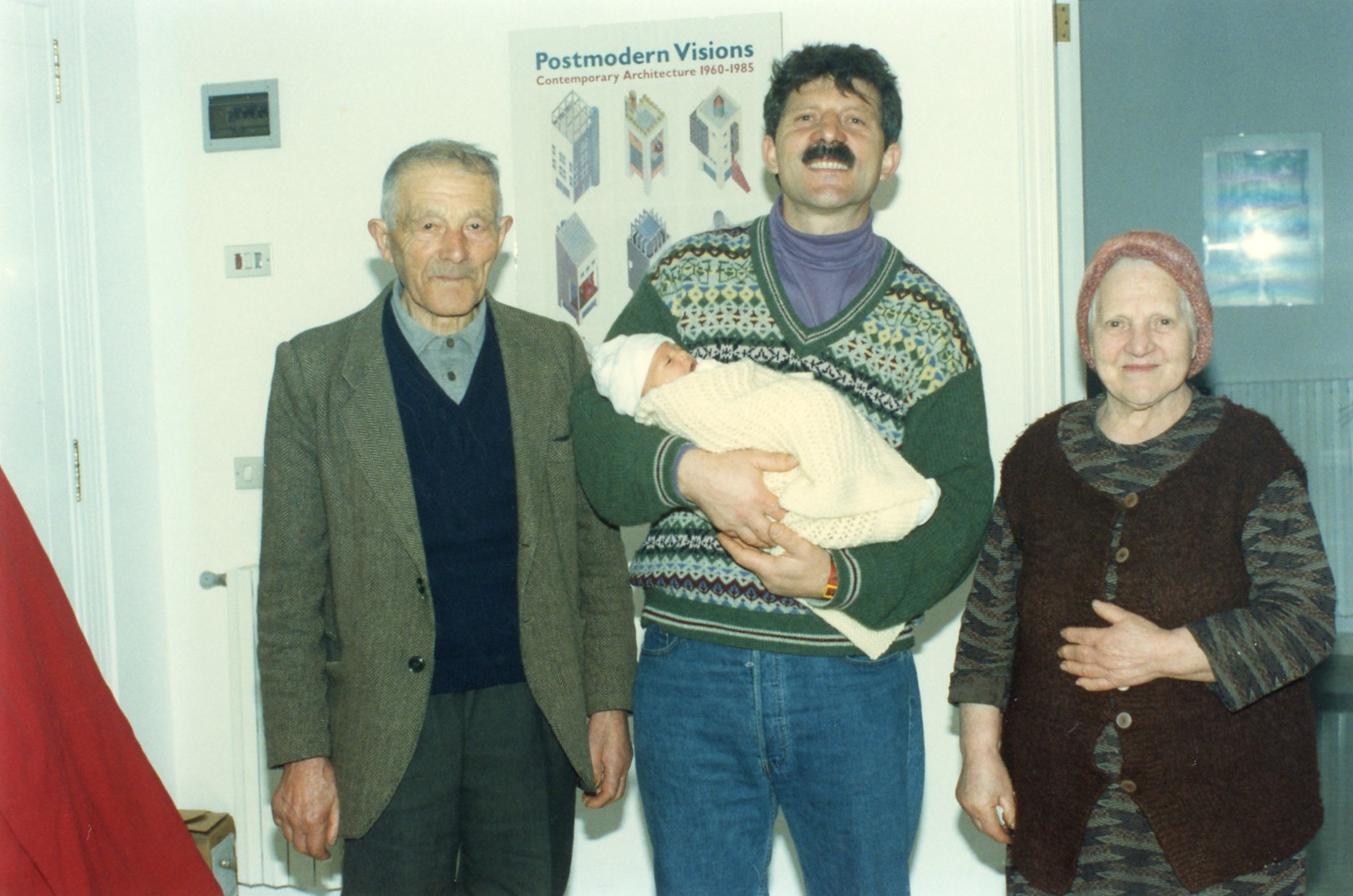 Francesco and his parents posing with newborn Sarah in 1994